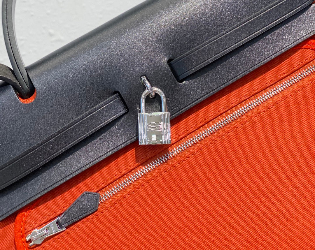 Herbag 31 Toile Red Orange Canvas Black Cowhide Leather